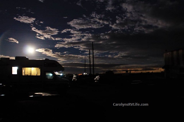 Stranded at auto repair shop on an RV - cloudy moonlit sky